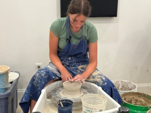 Girl making a vase at a pottery studio