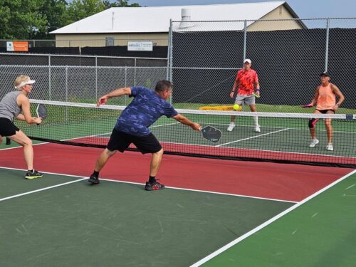 Group of 4 playing pickleball at Gower Park
