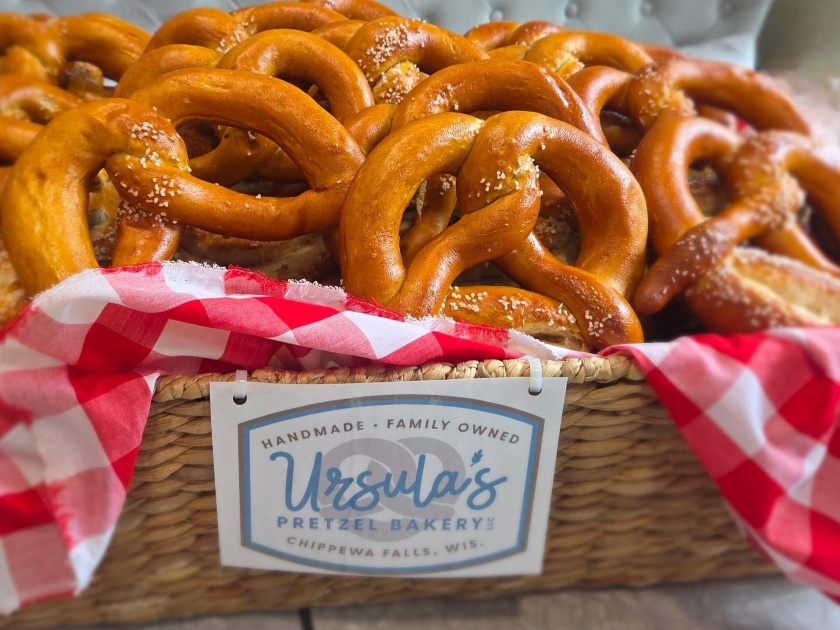 Basket of pretzels with the Ursula's Pretzel logo on it