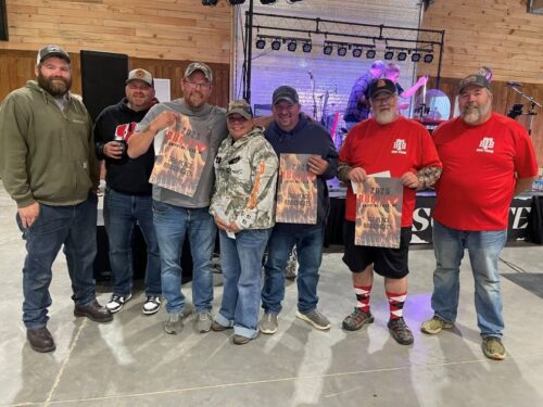 team celebrating a win at BBQ Fest