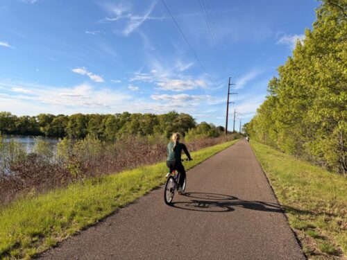 girl riding bike on the old abe state trail